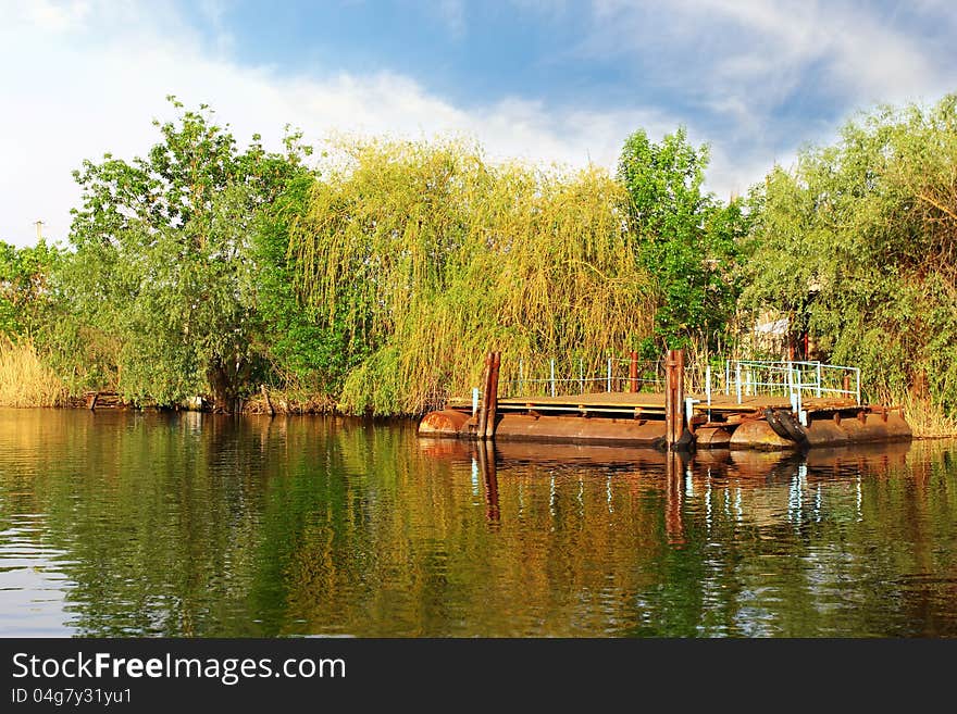 Floating moorage in the river over beautiful landscape