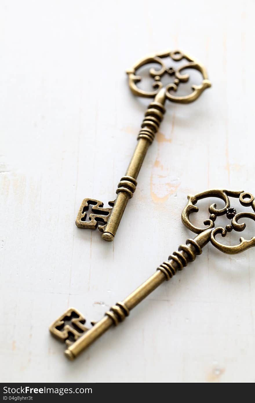 Close up of antique keys on white background