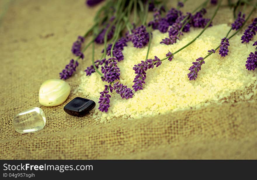 Black, whiteand transparent pebbles stones and lavender flowers. Black, whiteand transparent pebbles stones and lavender flowers