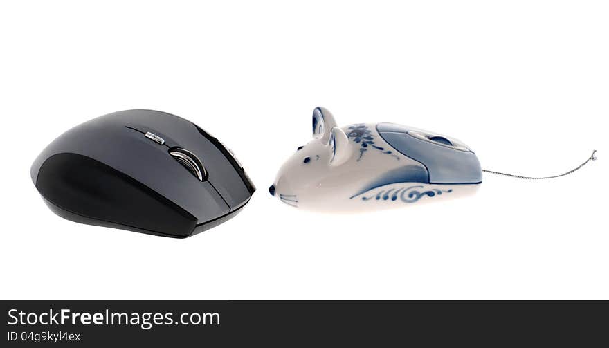 Grey wireless computer mouse and Russian Gzhel toy computer mouse isolated on white. Grey wireless computer mouse and Russian Gzhel toy computer mouse isolated on white