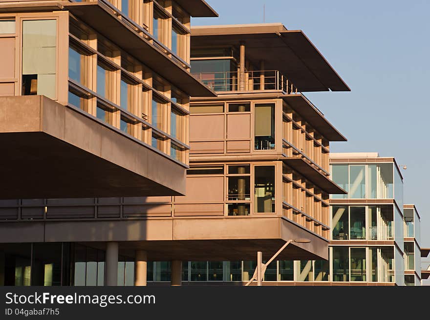 Business buildings in a row at the pier of the river Elbe in Hamburg. Business buildings in a row at the pier of the river Elbe in Hamburg