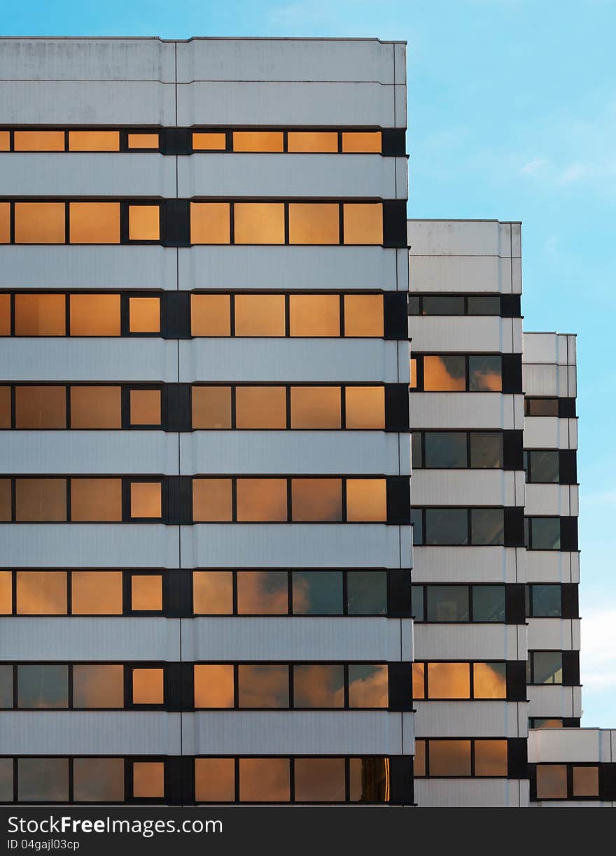 Modern business buildings in Hamburg (St.Georg) with reflections of the clouds on the windows. Modern business buildings in Hamburg (St.Georg) with reflections of the clouds on the windows.