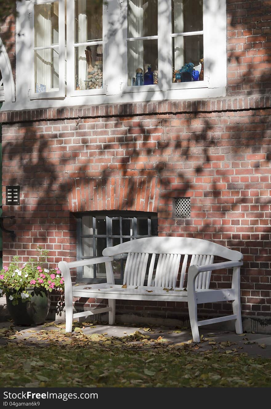 The wooden bench in a garden of a monastery in Hamburg.