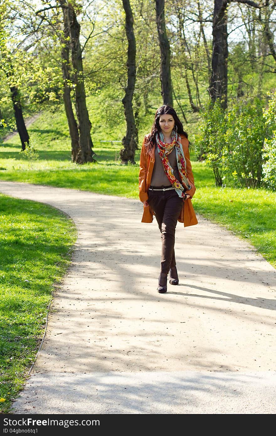 Young woman walking in a park