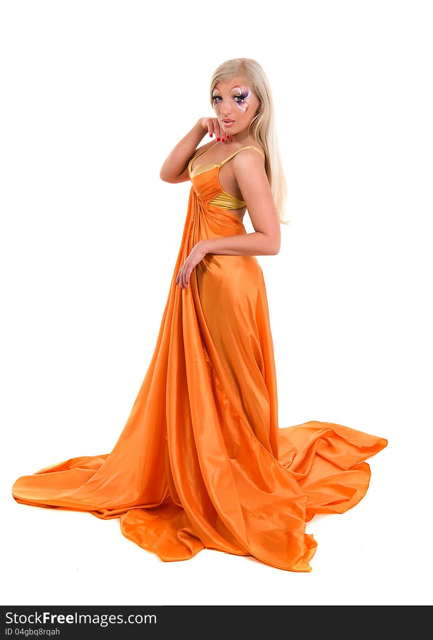 Girl in a flying orange fabric on a white background