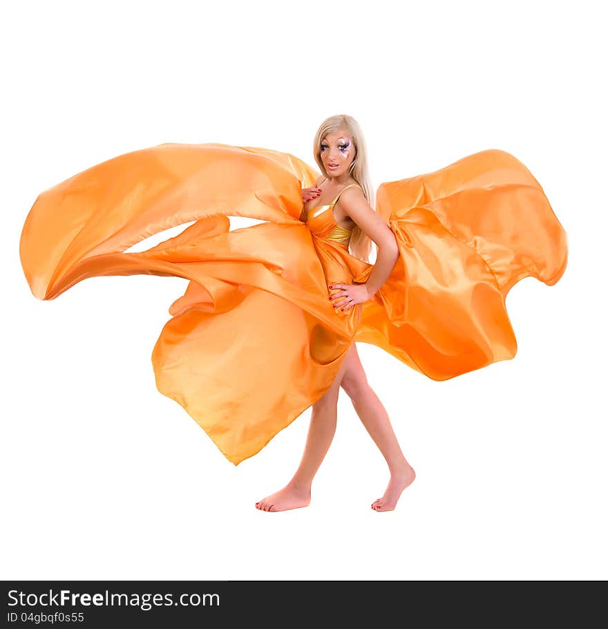 Girl in a flying orange fabric on a white background