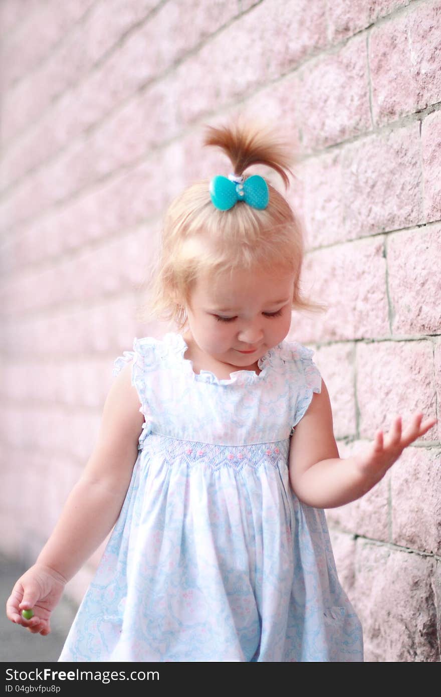 Portrait of the pretty smiling little girl