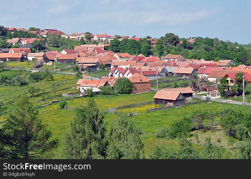 General view of a village and road in Transylvania land of Romania near Sibiu. This region is also called Marginimea Sibiului. General view of a village and road in Transylvania land of Romania near Sibiu. This region is also called Marginimea Sibiului.