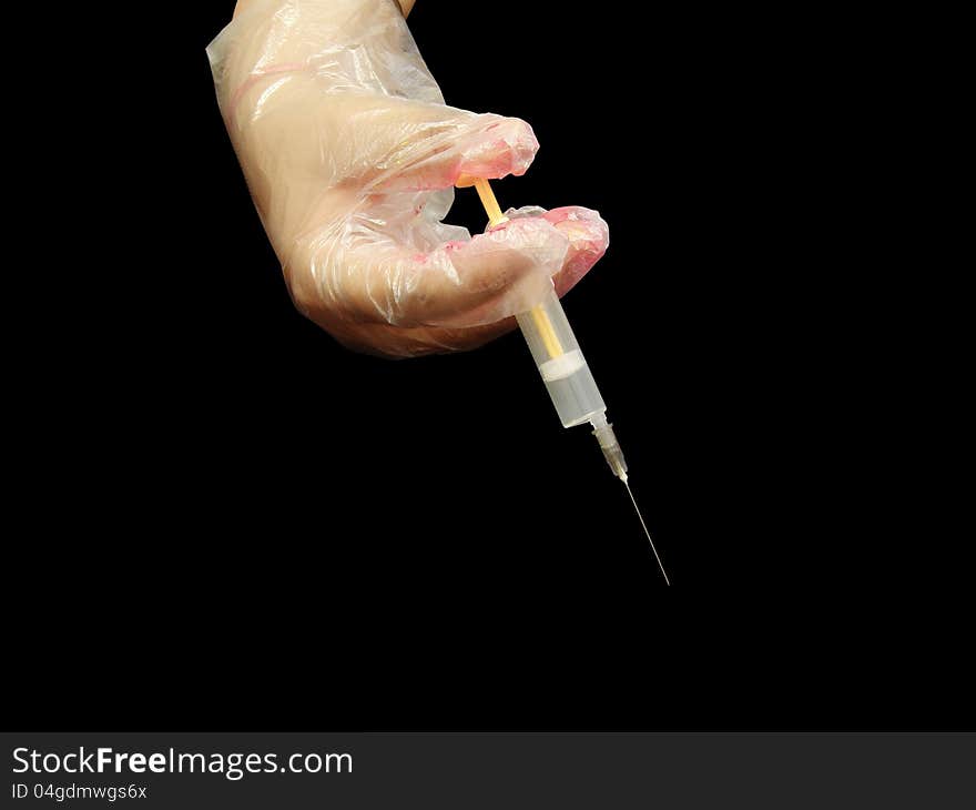 Syringe in hand with gloves. Syringe in hand with gloves