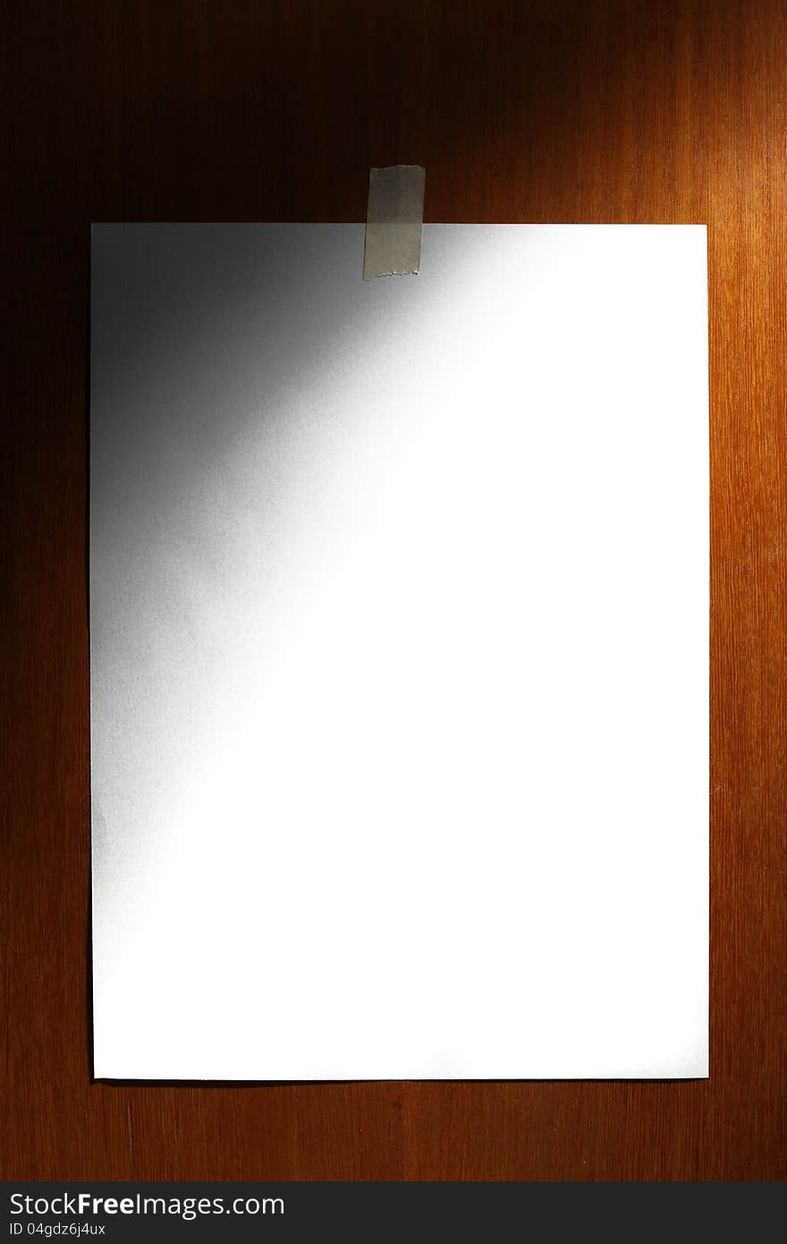 White paper on wooden background