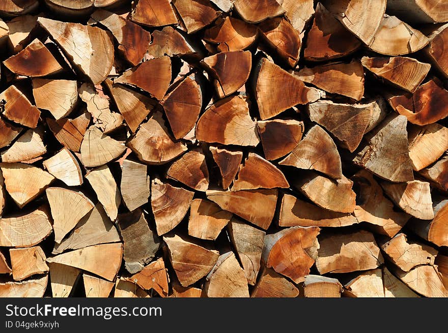 Cut branches at a wood exploitation and stored on a mountain valley. Cut branches at a wood exploitation and stored on a mountain valley