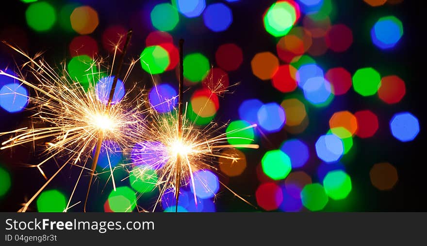 Two bengal lights on colorful background