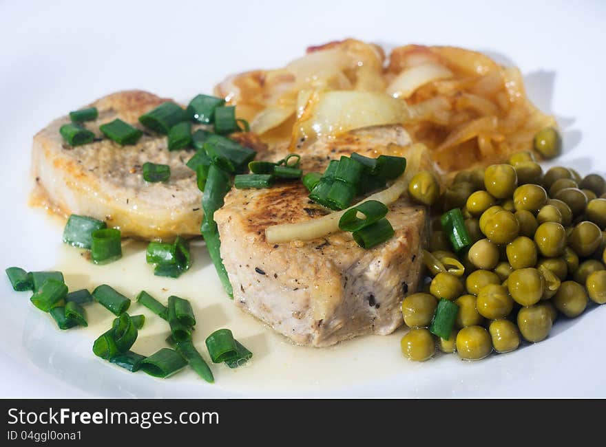 Peace Of Fringed Meat With Garnish On White Plate.