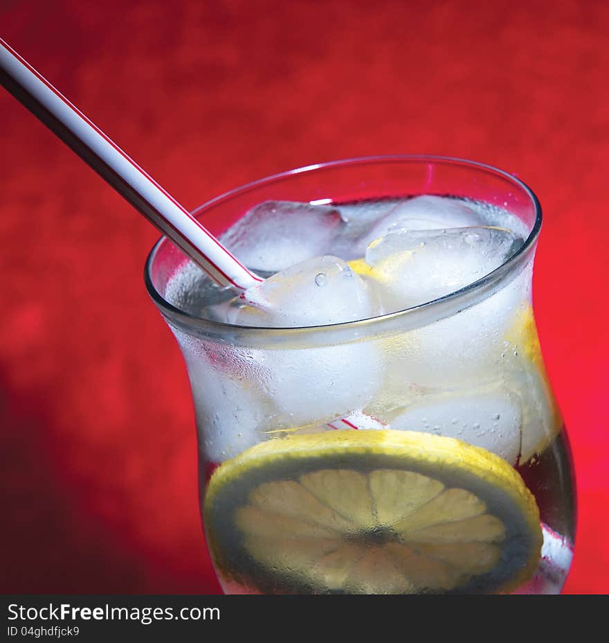 Cold fresh lemonade  on  red background