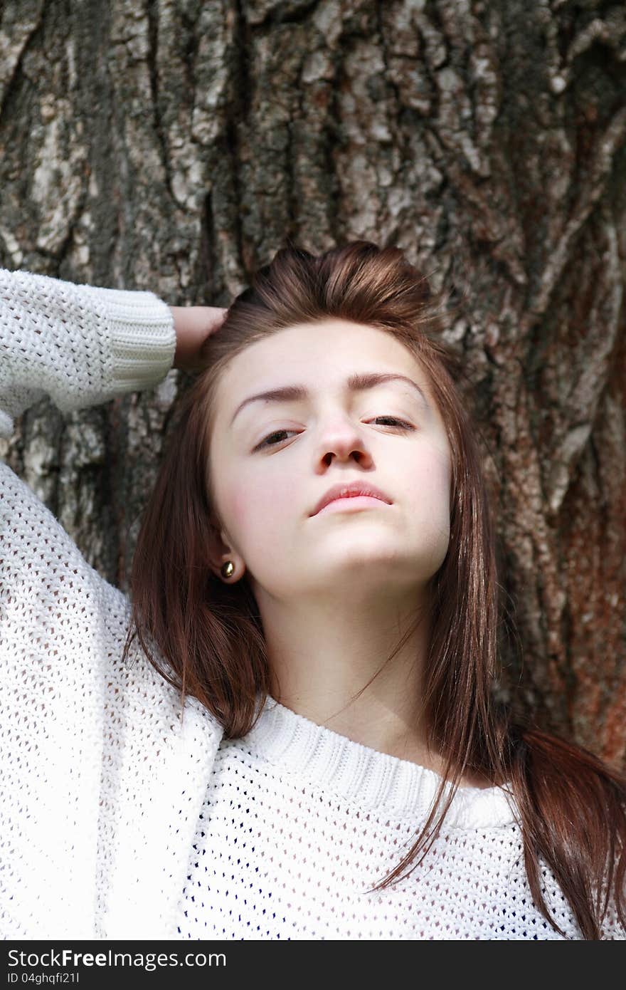 Portrait of beauty teenage girl on tree bark background. Portrait of beauty teenage girl on tree bark background