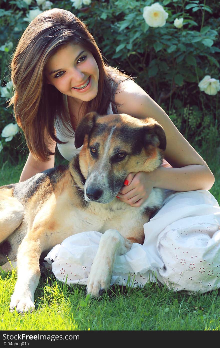 Smiling Teenager With Her Dog