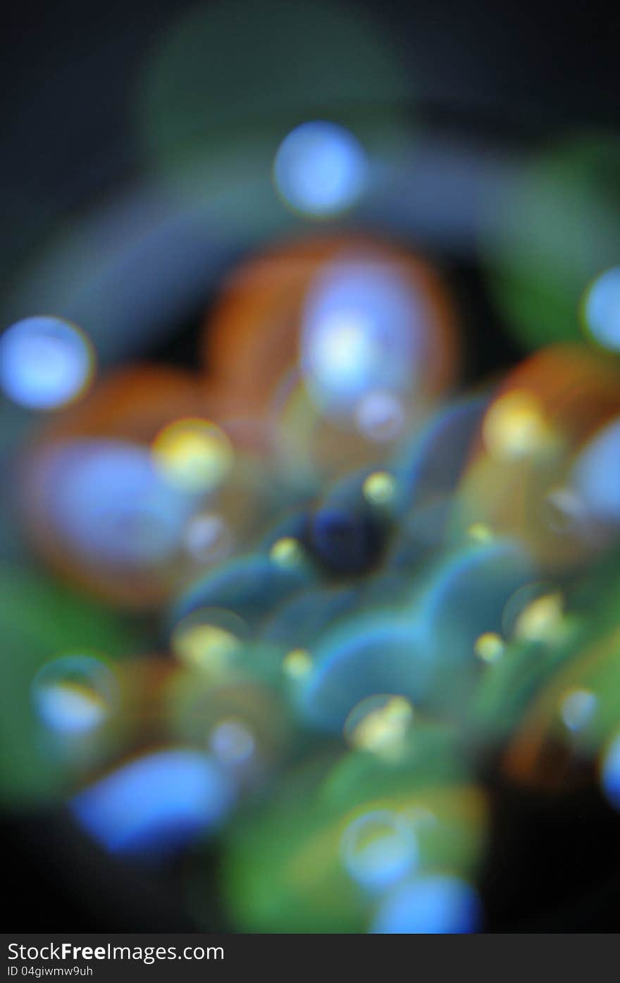 This is an image using a LED ring light at a different angle shooting into the first element of a lens to give the illusion of floating bubbles. This is an image using a LED ring light at a different angle shooting into the first element of a lens to give the illusion of floating bubbles.