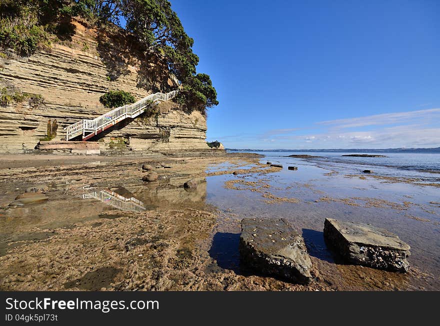 Steps on the coastline leading down to the beach and rocks. Steps on the coastline leading down to the beach and rocks.