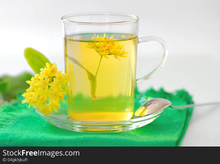 Cup of linden tea and flowers shoot in studio