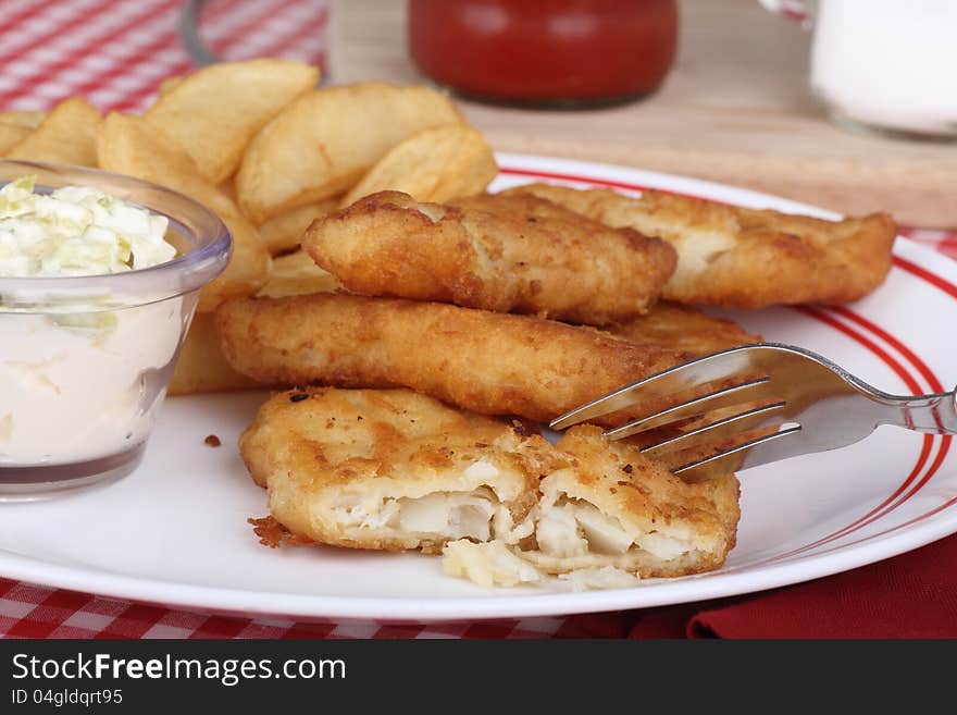 Battered fish fillet meal with french fries. Battered fish fillet meal with french fries