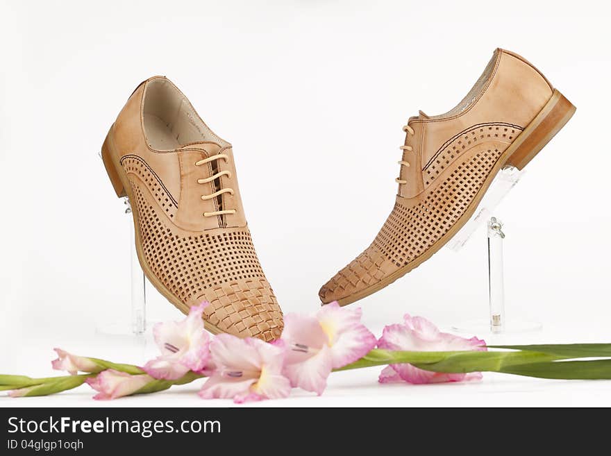 Men shoes with rose on white background