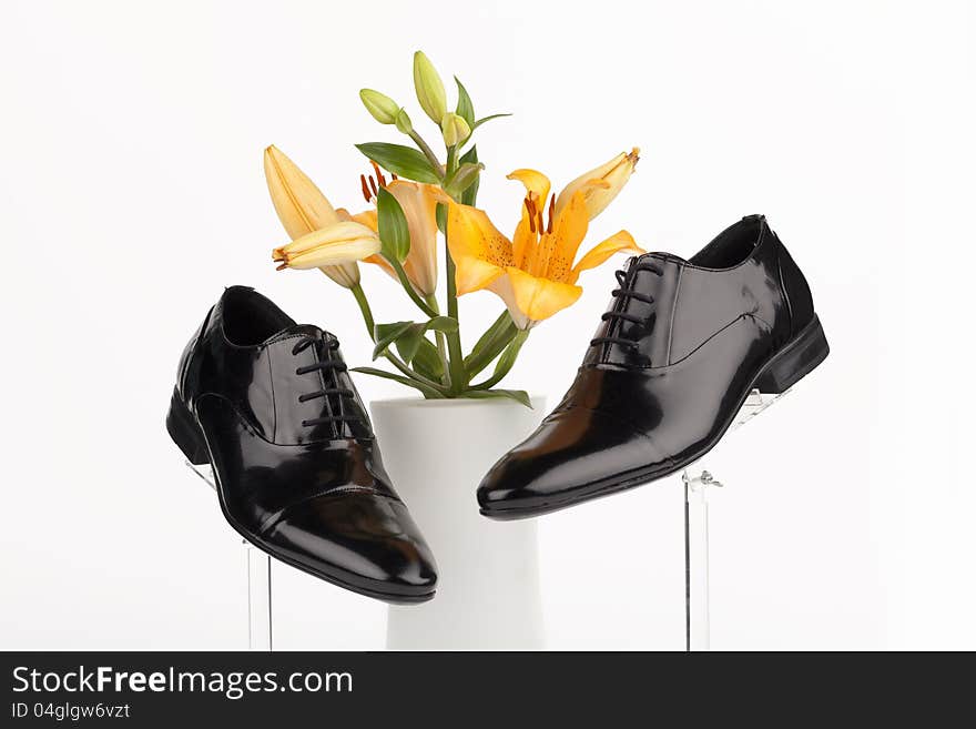 Men shoes with rose on white background