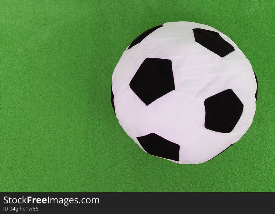 Soccer ball on green background