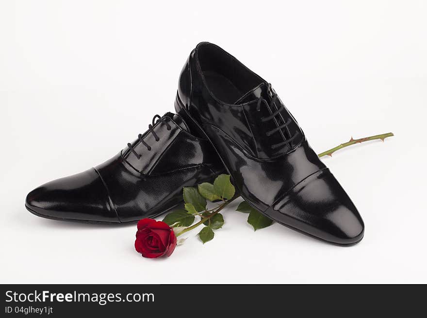 Men shoes with rose on white background