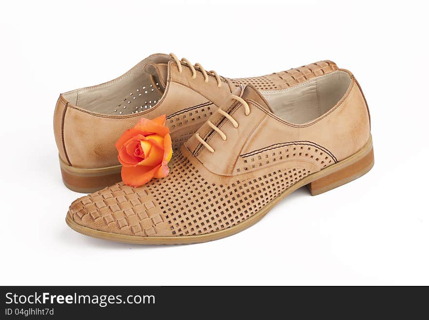 Men shoes with rose on white background