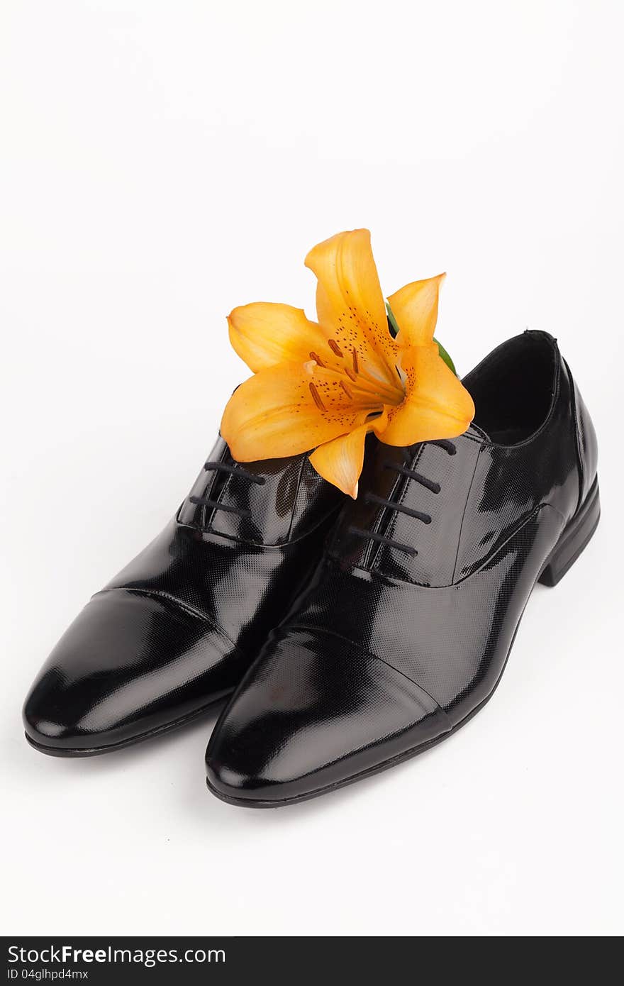 Men shoes with flower on white background