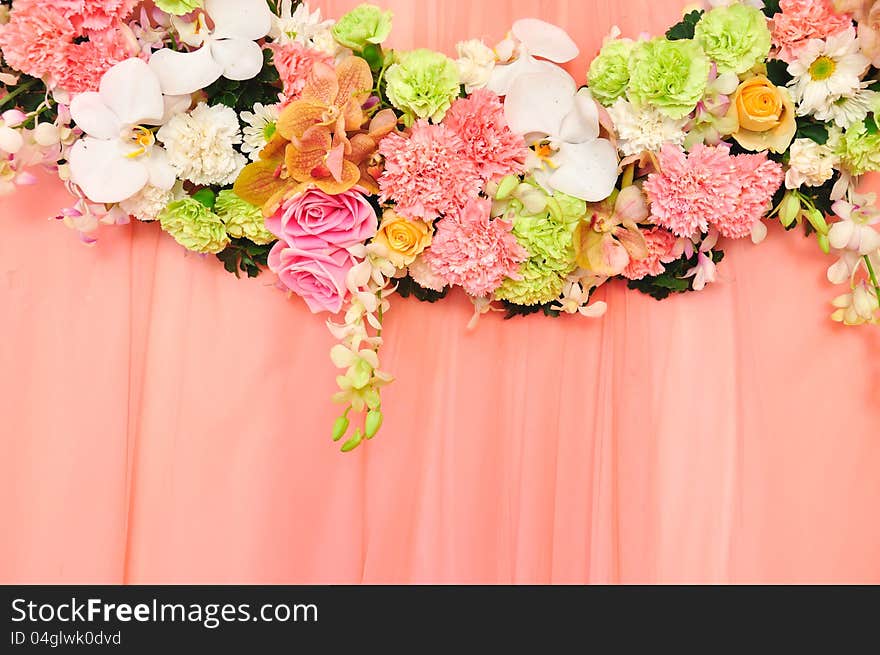 Beautiful flowers blossom on pink curtain backgrou