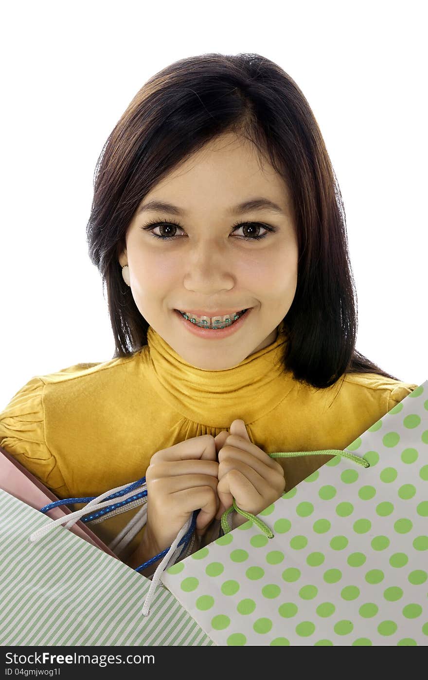 Shopping woman hold bags isolated over white background