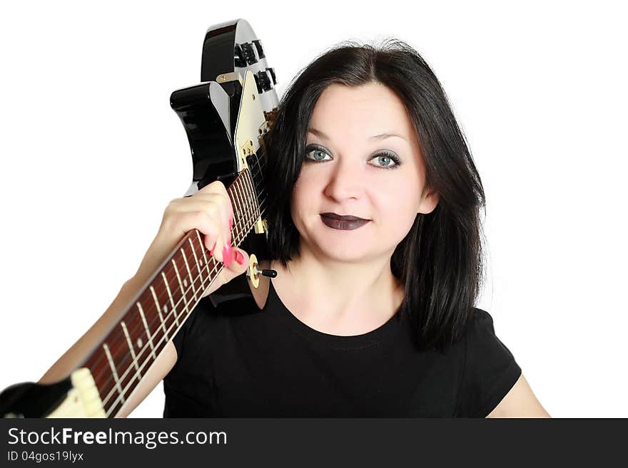 Brunette Girl Posing With A Guitar On His Shoulder