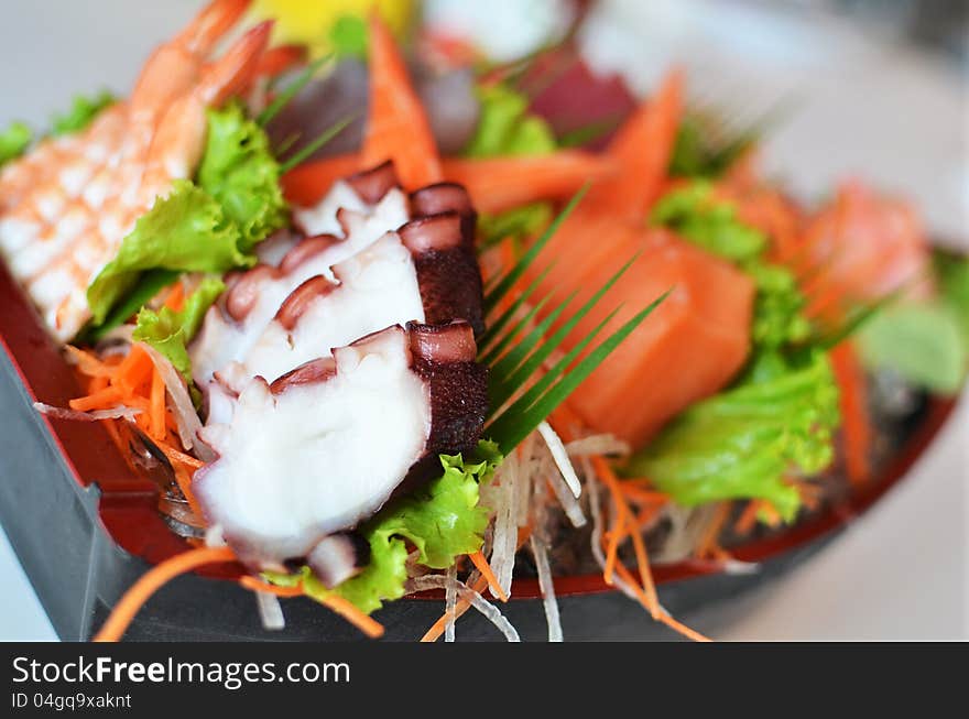 Sashimi seafood set in a boat blow