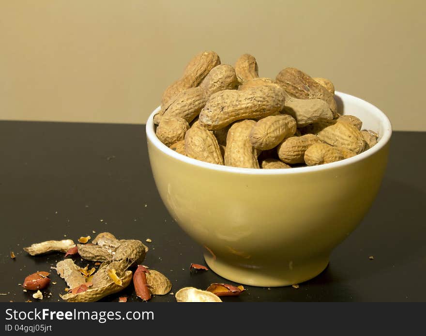 Bowl of peanuts in shell