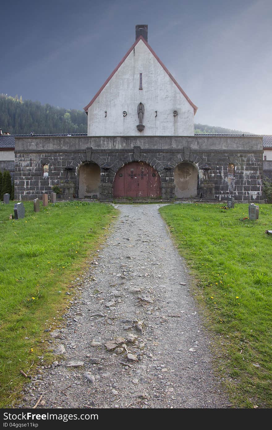 Pathway to buildning in graveyard