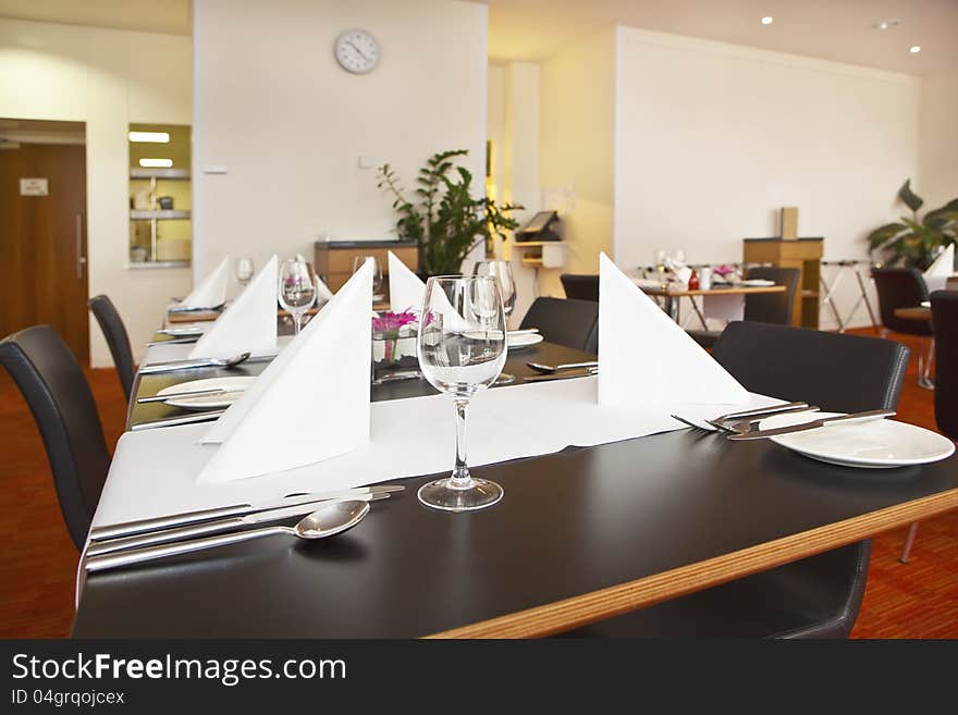 Tables With Formal Setup In Modern Restaurant