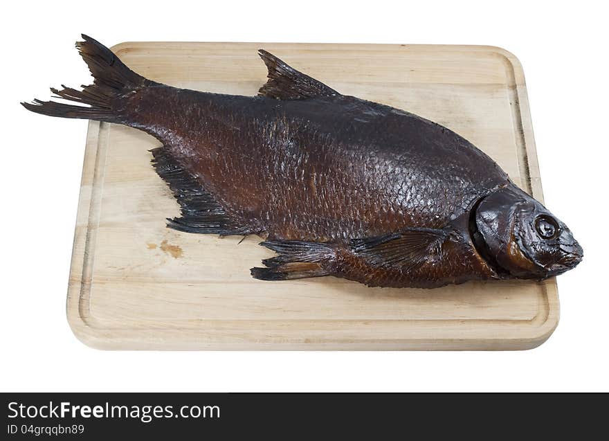 Smoked bream on a wooden board on white isolated background