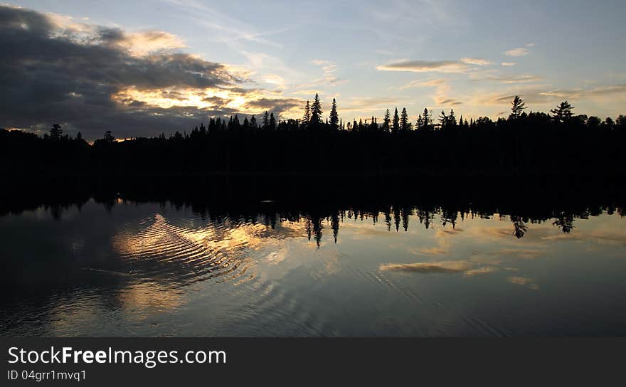 Landscape with sunset forest and lake