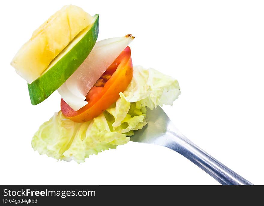 The mix fruit and vegetable on fork. The mix fruit and vegetable on fork