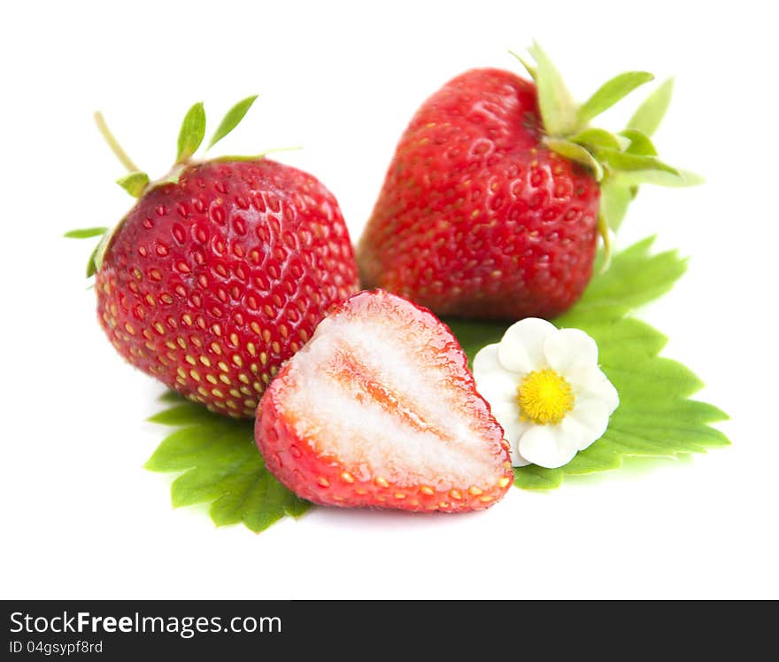 Strawberries with green leaves on a white background