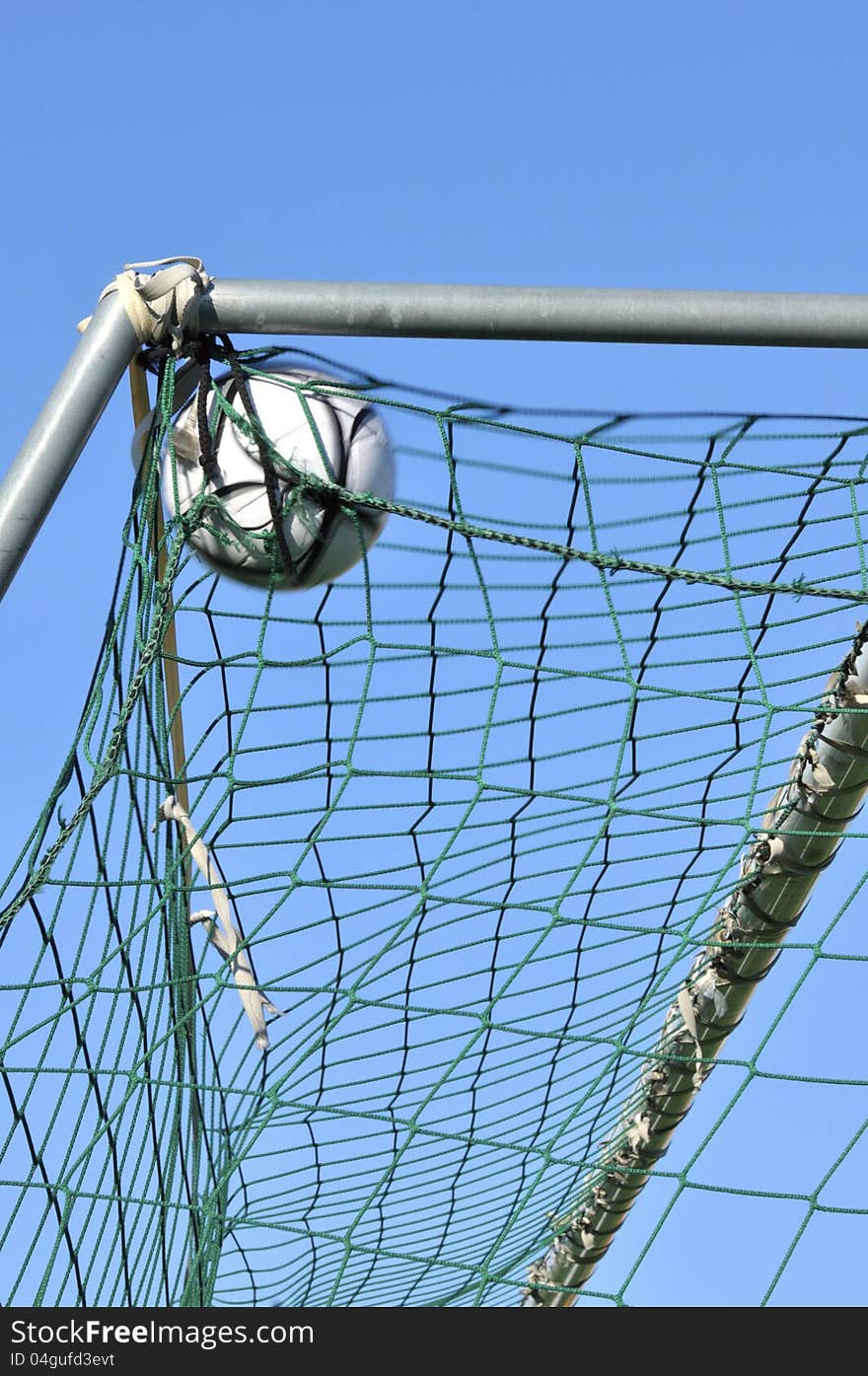 Football in the a goal net