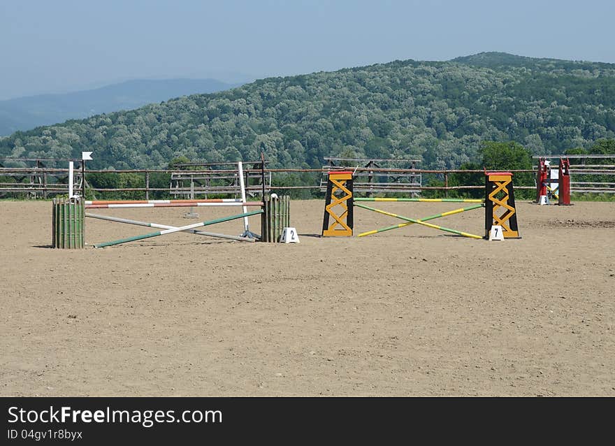 Numbered obstacle on sunny hippodrome