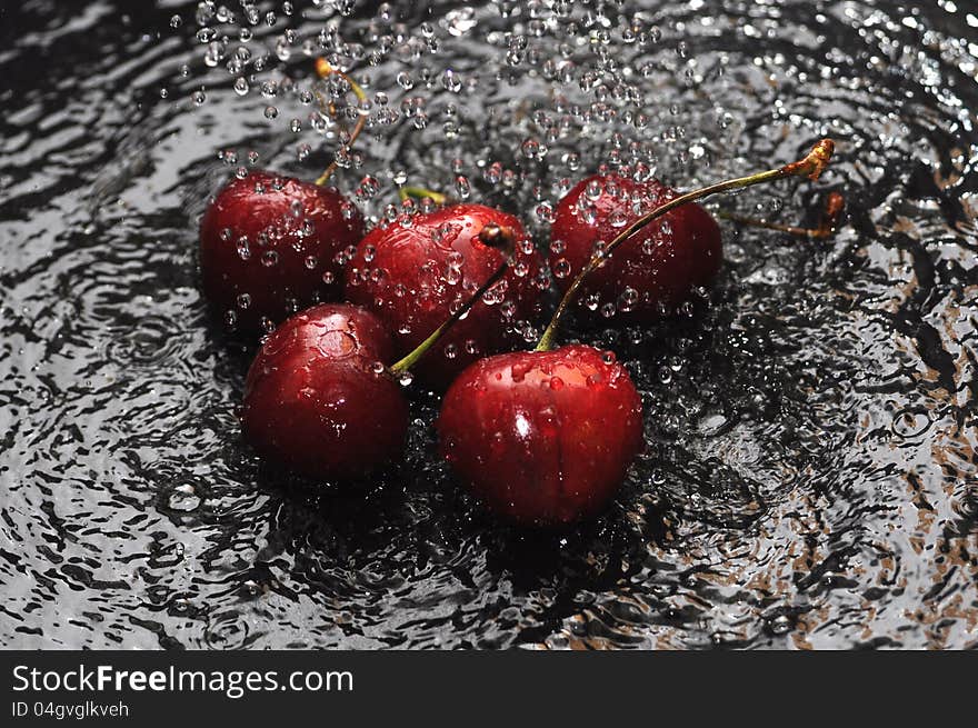 Red cherries in water