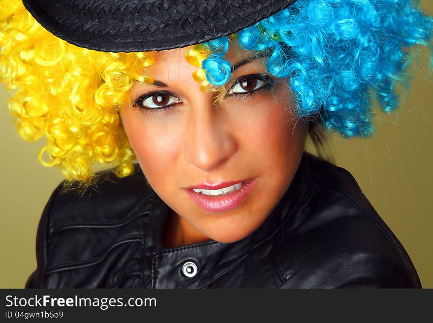 Portrait of a girl with a wig and a hat