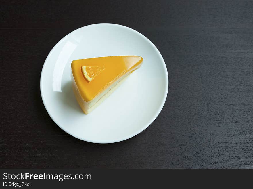 Orange cake on wood table