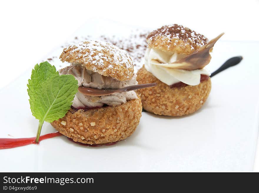 Tartlets on a white plate in a restaurant