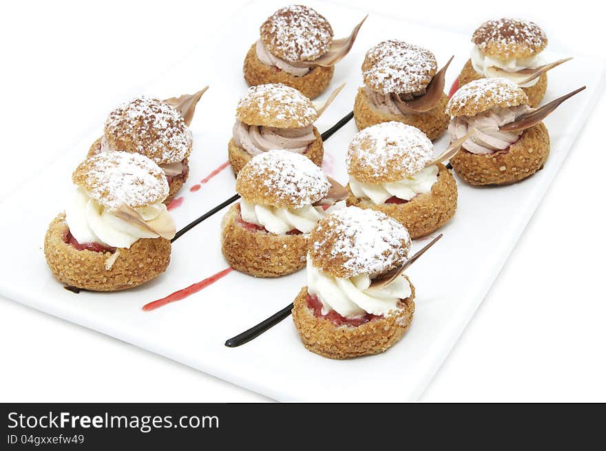 Tartlets on a white plate in a restaurant