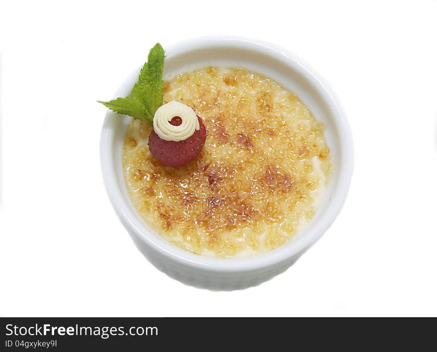 Creme brulee on a white background in the restaurant. Creme brulee on a white background in the restaurant