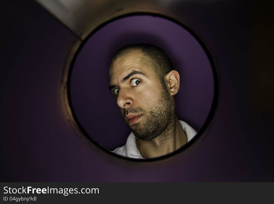 Man looking at a hole